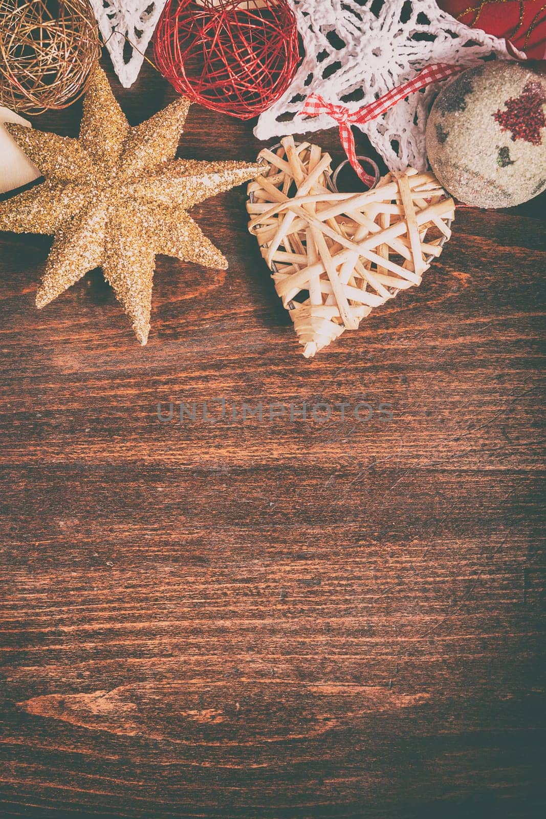 Different type of christmas decoration on wooden background by DCStudio