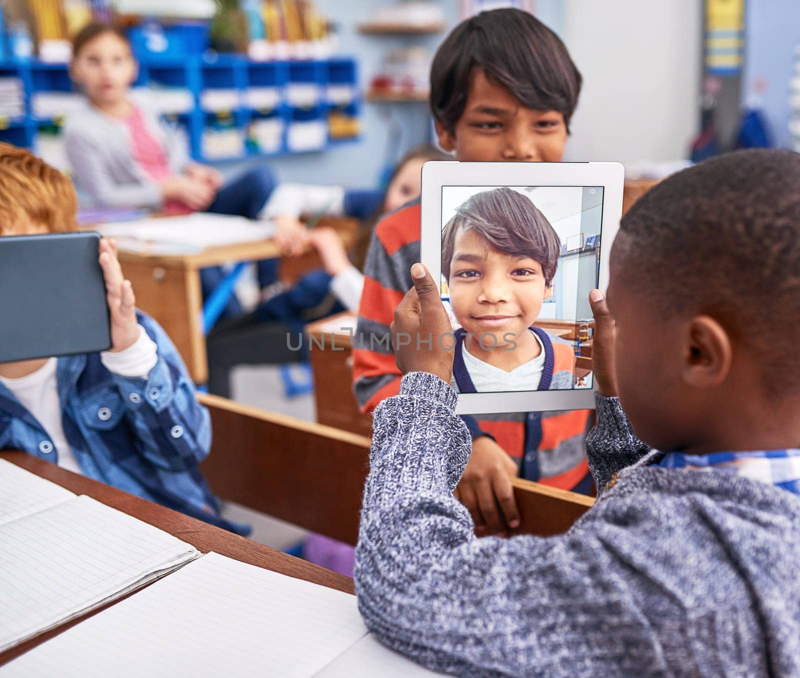 This is my best friend. elementary school children using a tablet in class