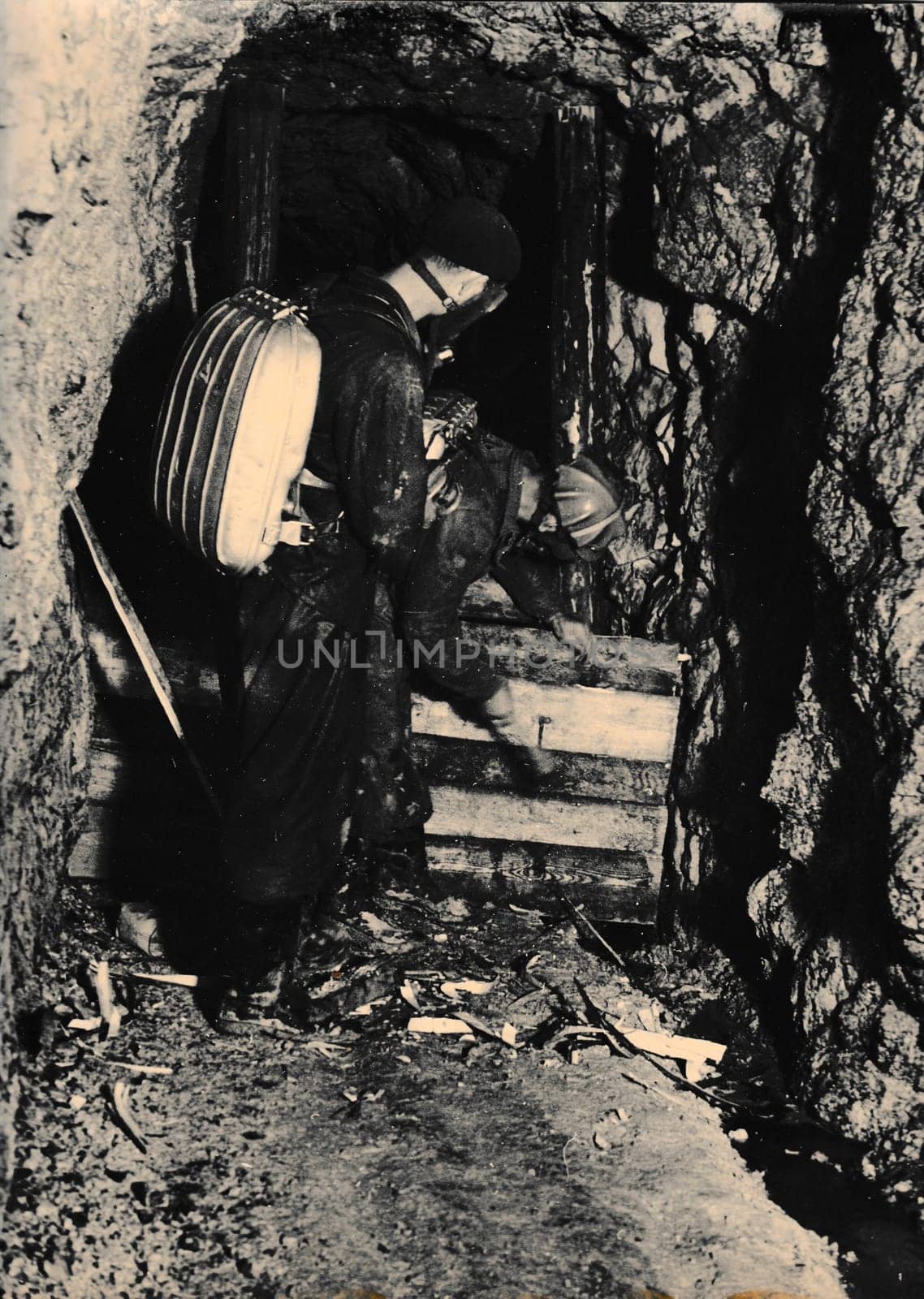 THE CZECHOSLOVAK SOCIALIST REPUBLIC - CIRCA 1960s: Retro photo shows miner rescuers in the coalmine. Black and white vintage photography