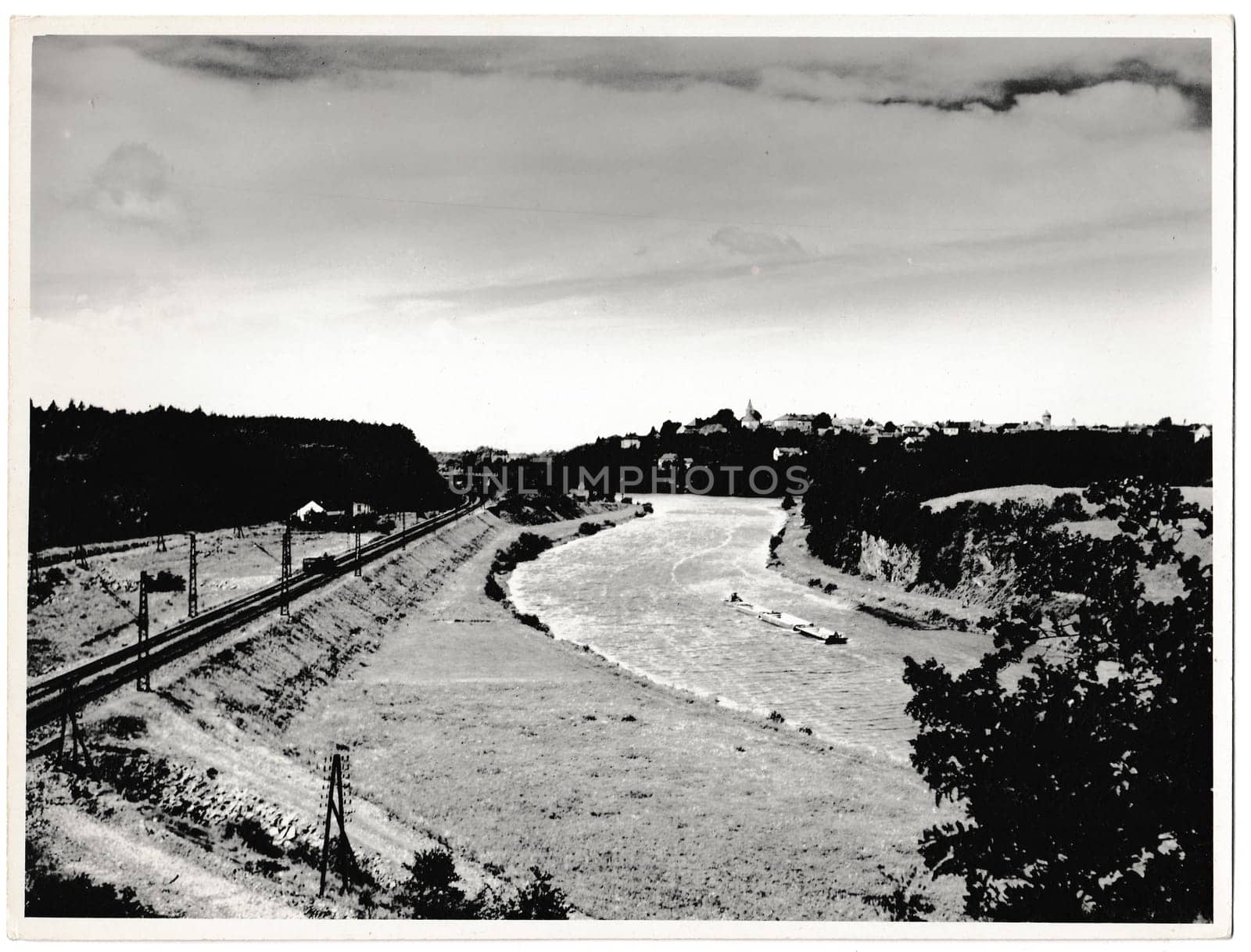 THE CZECHOSLOVAK SOCIALIST REPUBLIC - CIRCA 1960s: Retro photo shows railway and the pontoons on the river. Black and white vintage photography.