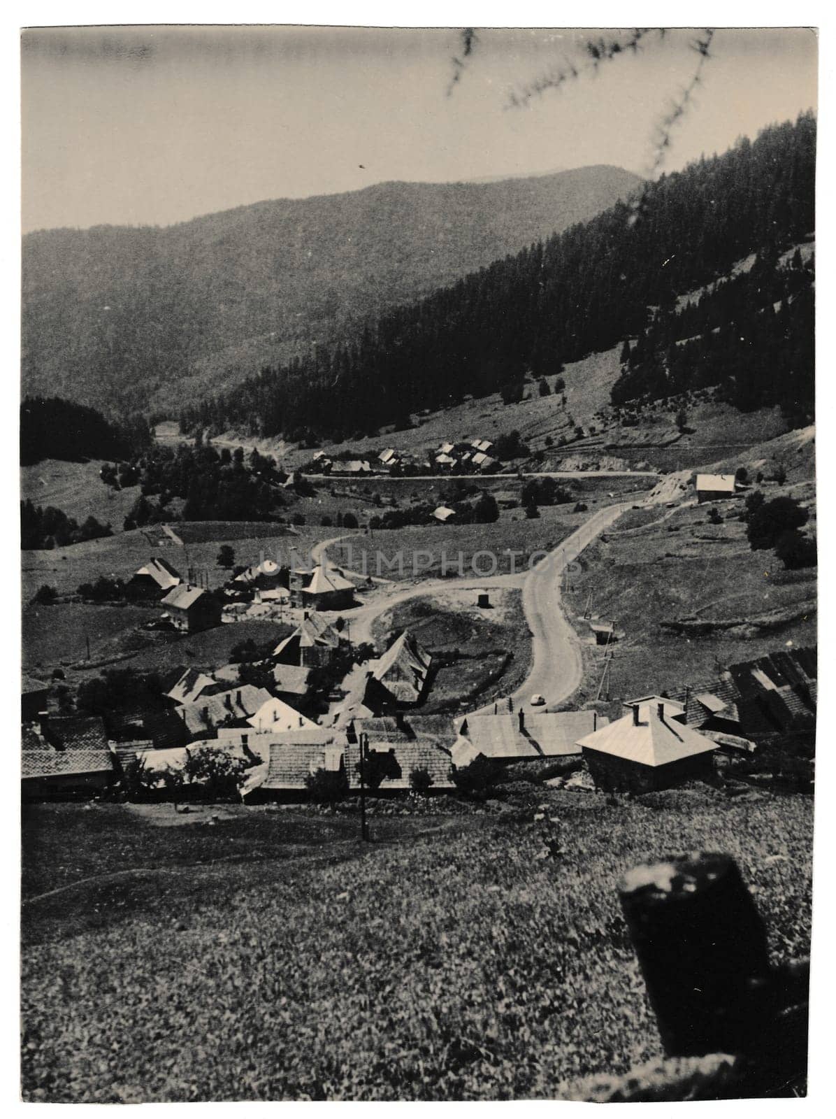 Retro photo shows view on mountain village. Black & white vintage photography by roman_nerud