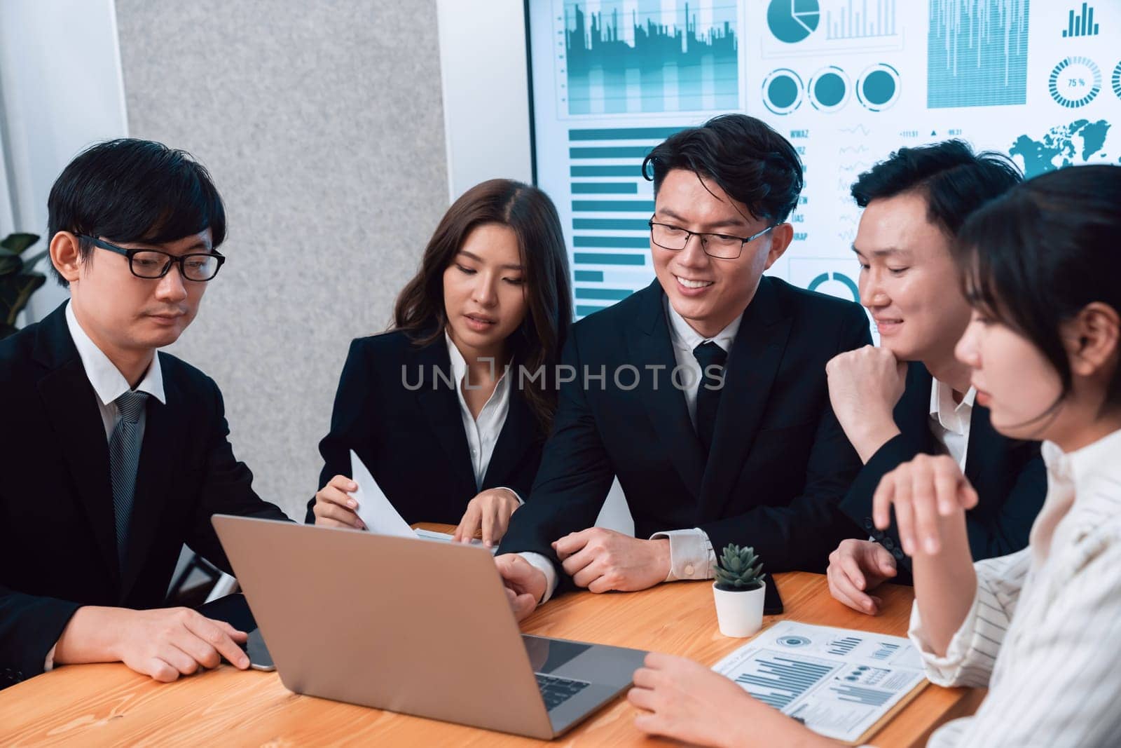 Business team of financial data analysis meeting with business intelligence, report paper and dashboard on laptop for marketing strategy. Business people working together to promote harmony in office.