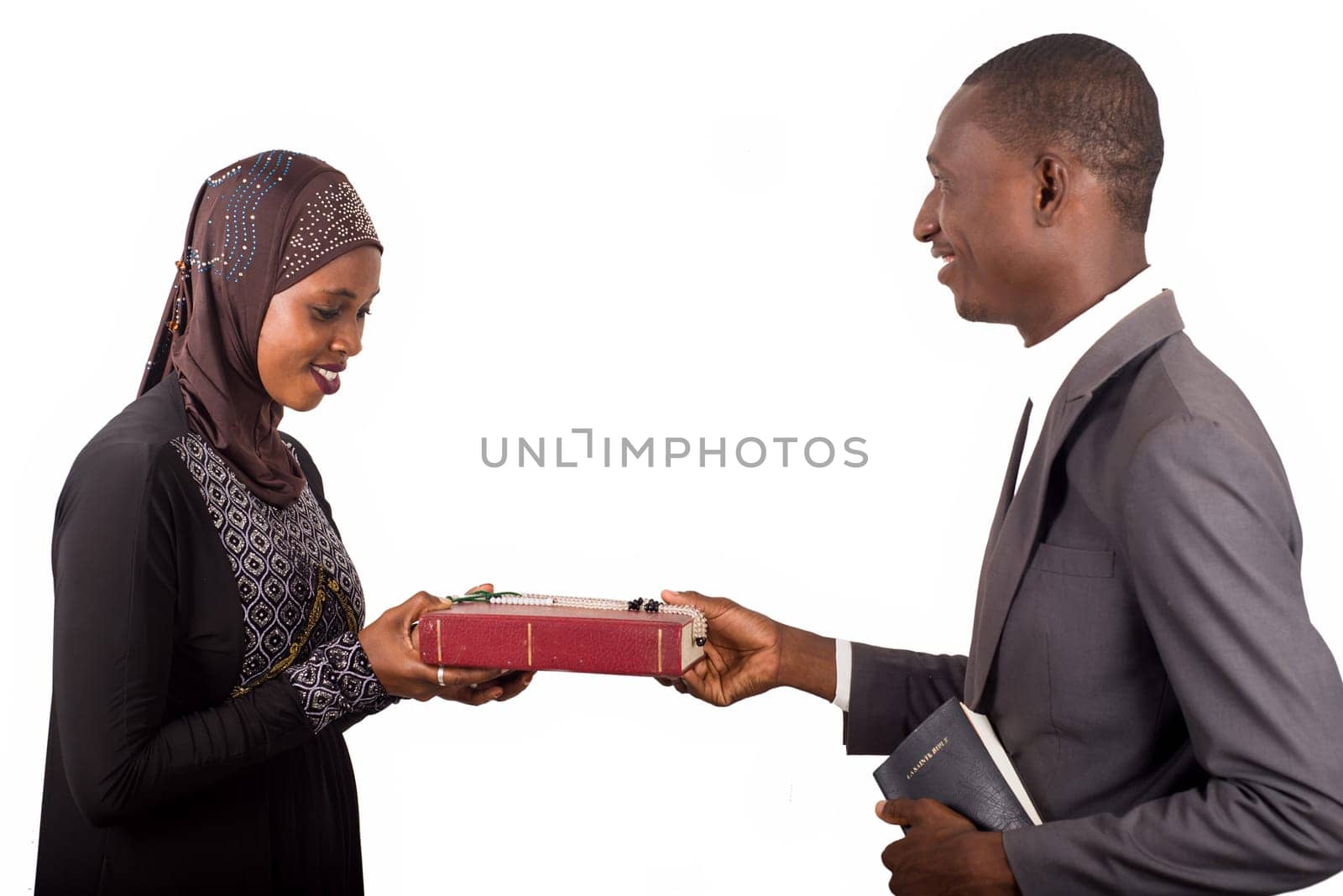 portraits of two smiling religious people holding a book on white background