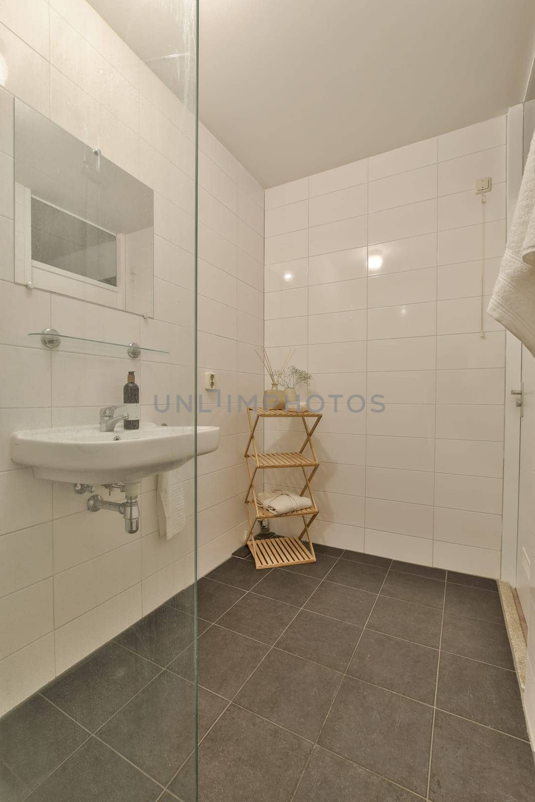 a bathroom that is very clean and ready to be used for the washrooms or toiletries, as well