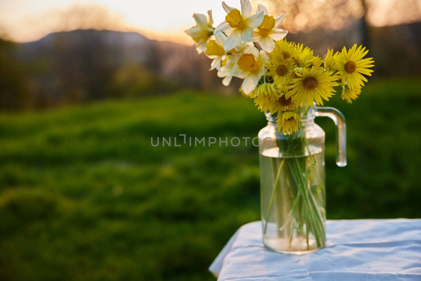 a bouquet of spring flowers standing in a vase on the street. High quality photo