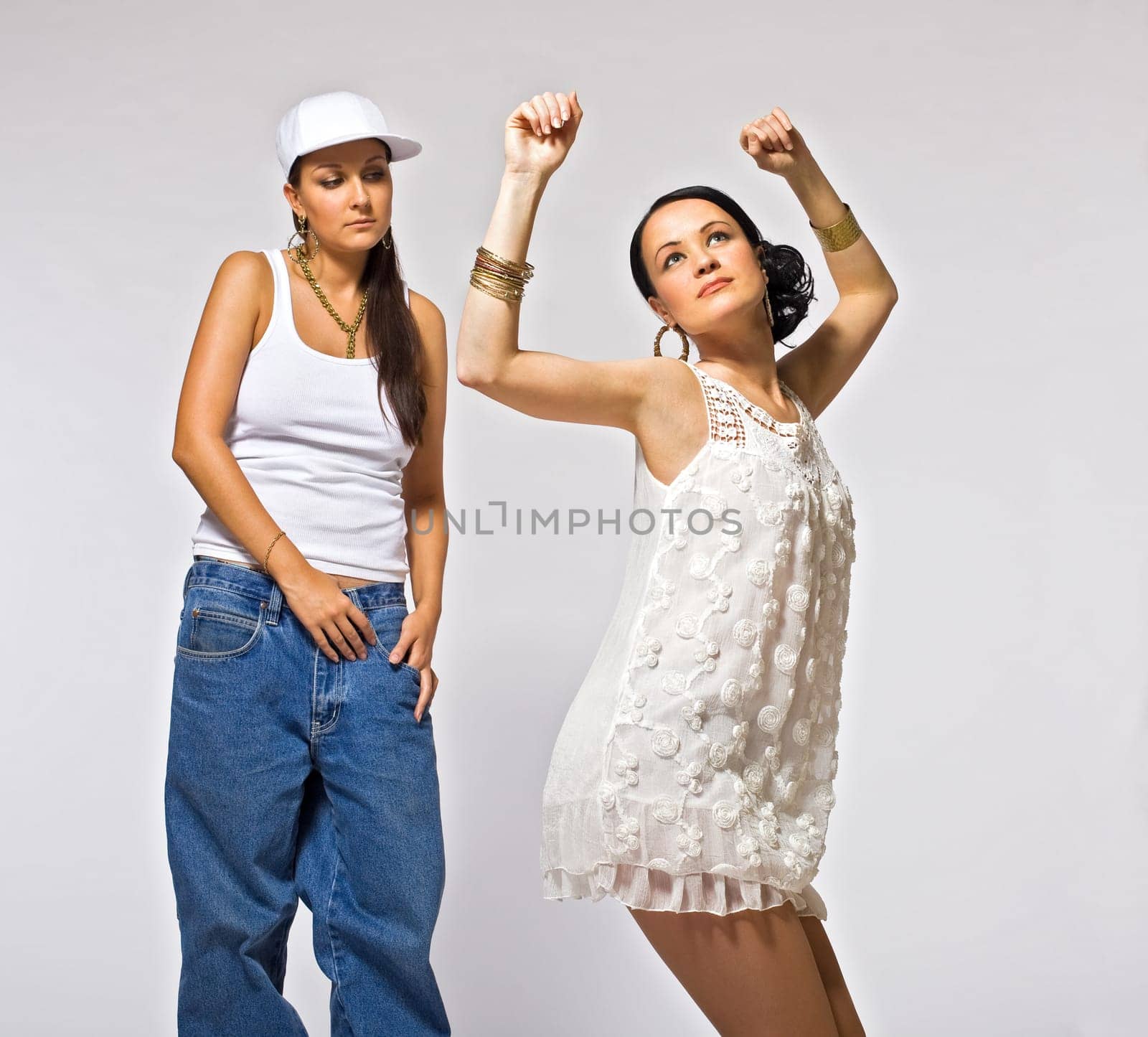 Two young woman dance by rivertime