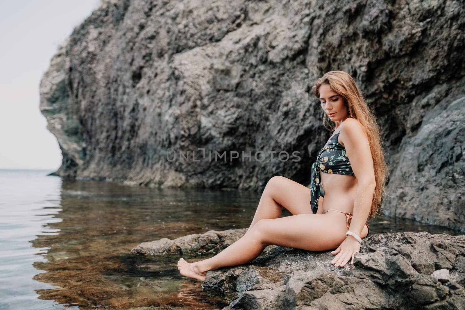Woman travel sea. Happy tourist enjoy taking picture outdoors for memories. Woman traveler swim in the sea bay with mountains, sharing travel adventure journey by panophotograph