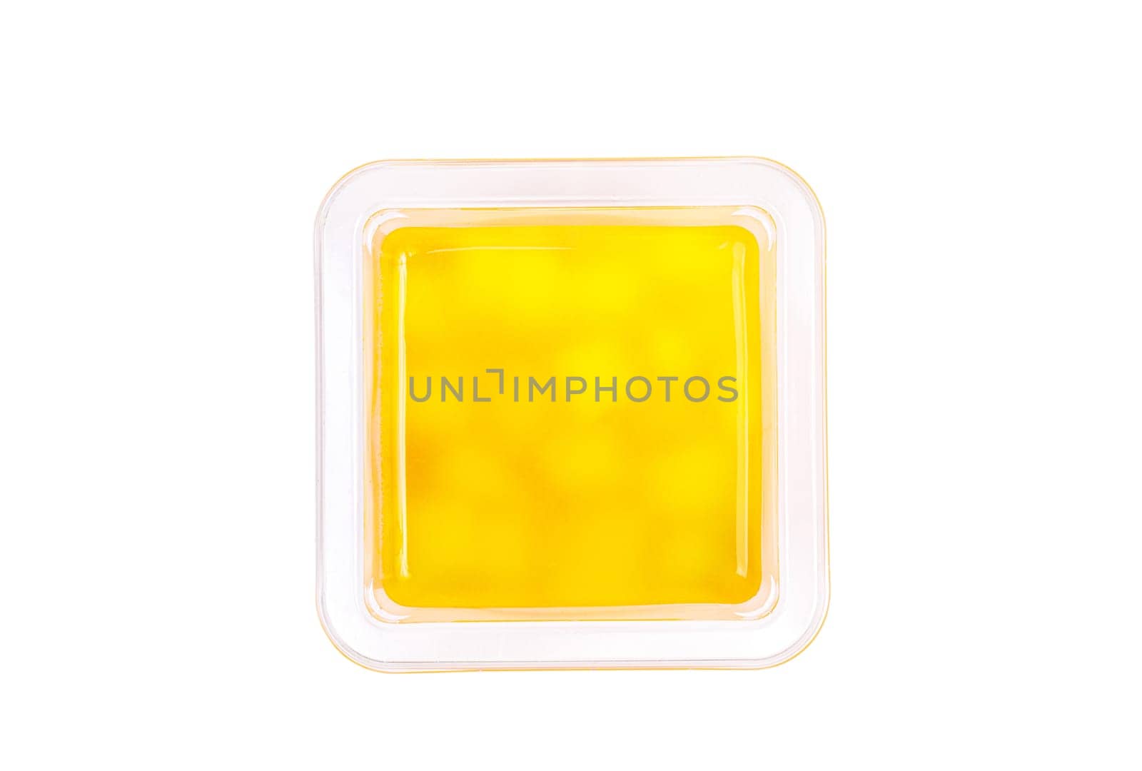 Grapefruit, mango and raspberry jelly in a plastic cup on a white background. View from above. High quality photo