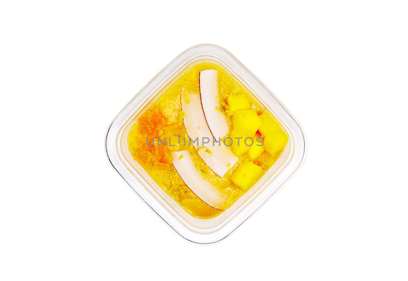 Smoothies with fresh fruits and nuts. Smoothie bowl, mango, passion fruit, coconut. Applesauce, lemon zest. High quality photo.