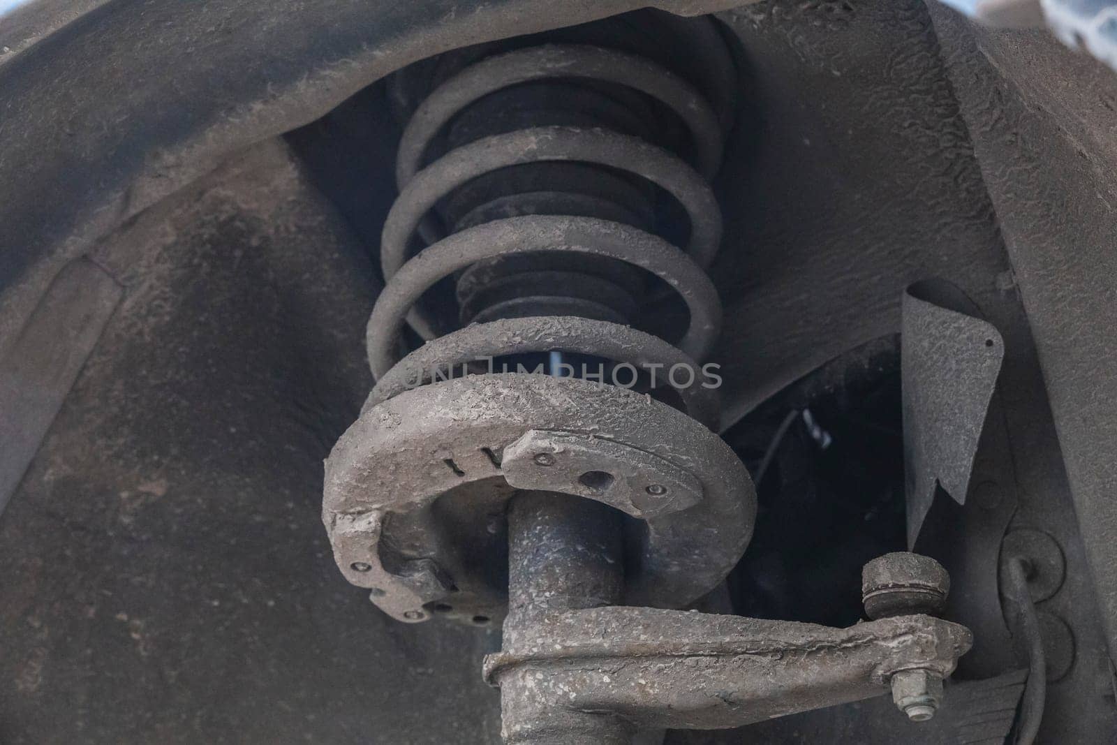 old dirty tie rod end and shock absorber.