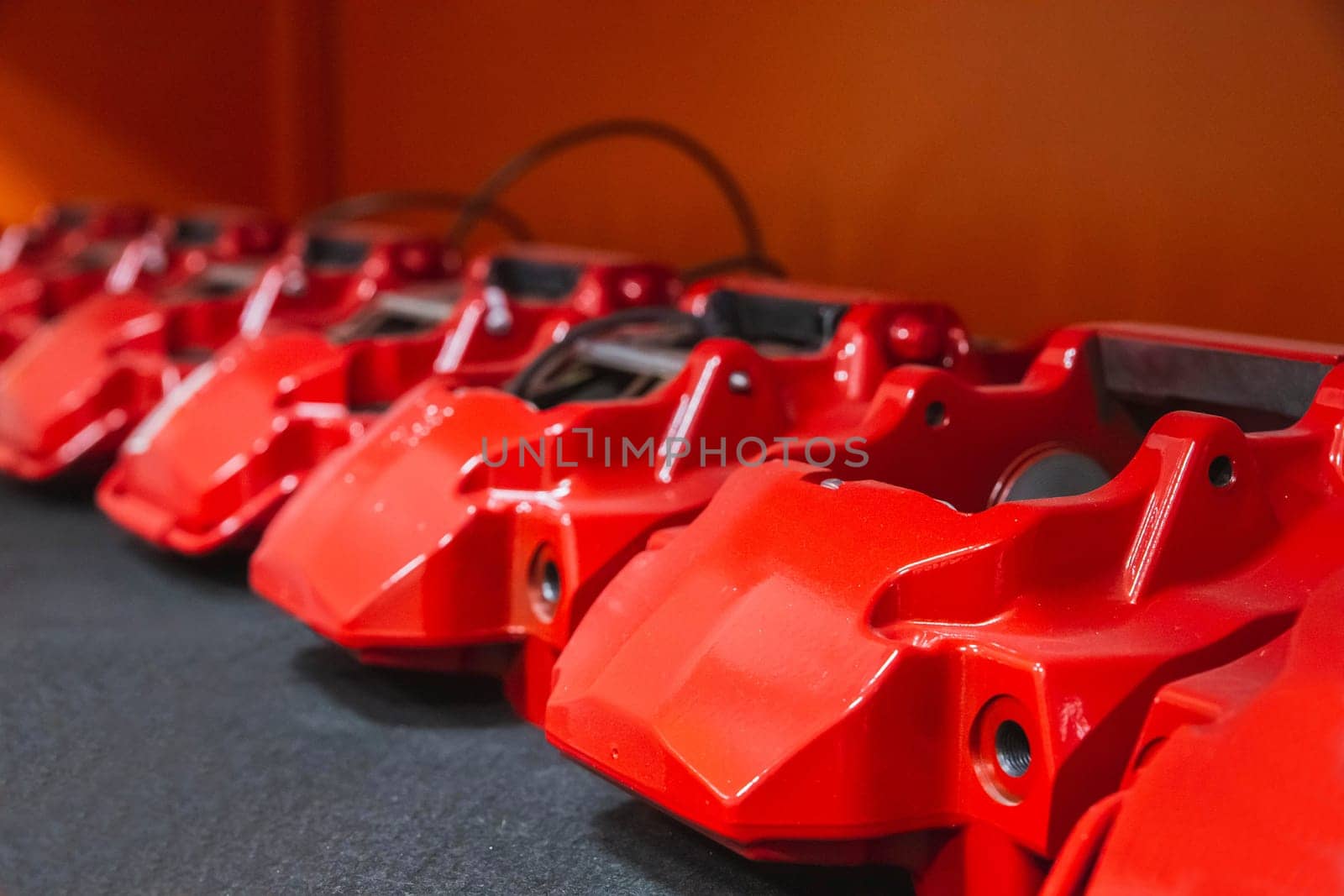 red car supports which are used in brakes lie in a row.