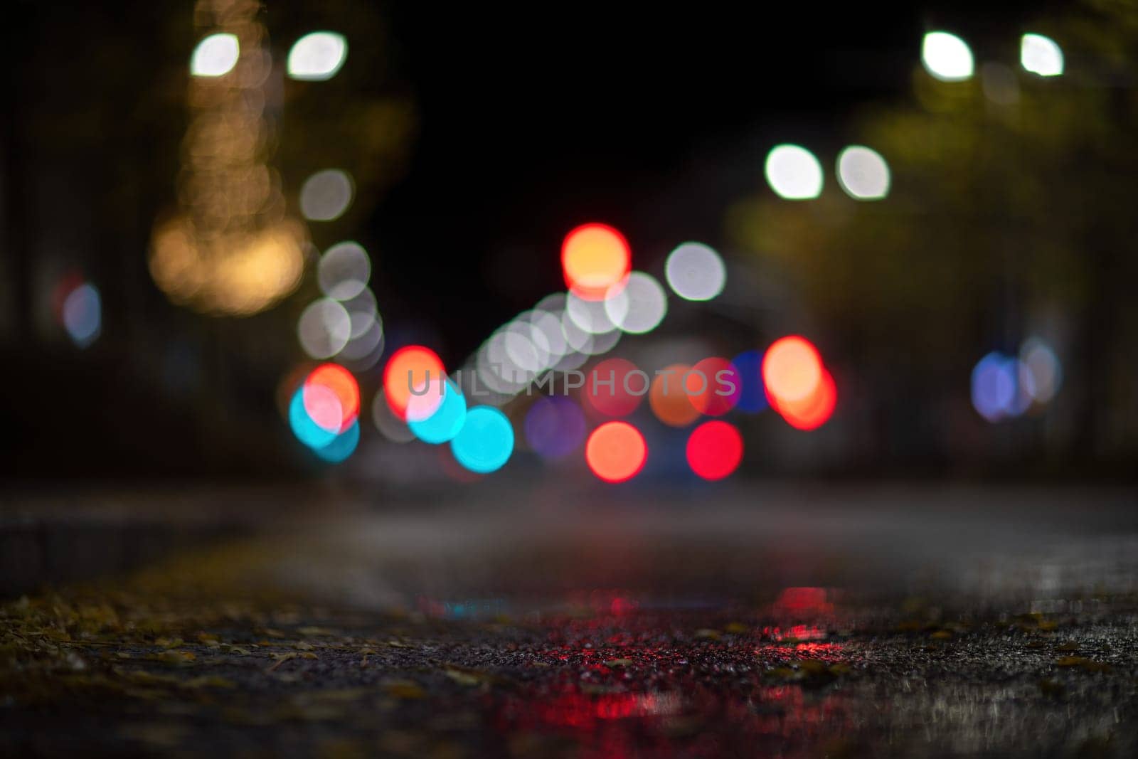 Blurred footage of transport. Blur of city lights along the road, light out of focus at night. Night city traffic, beautiful background