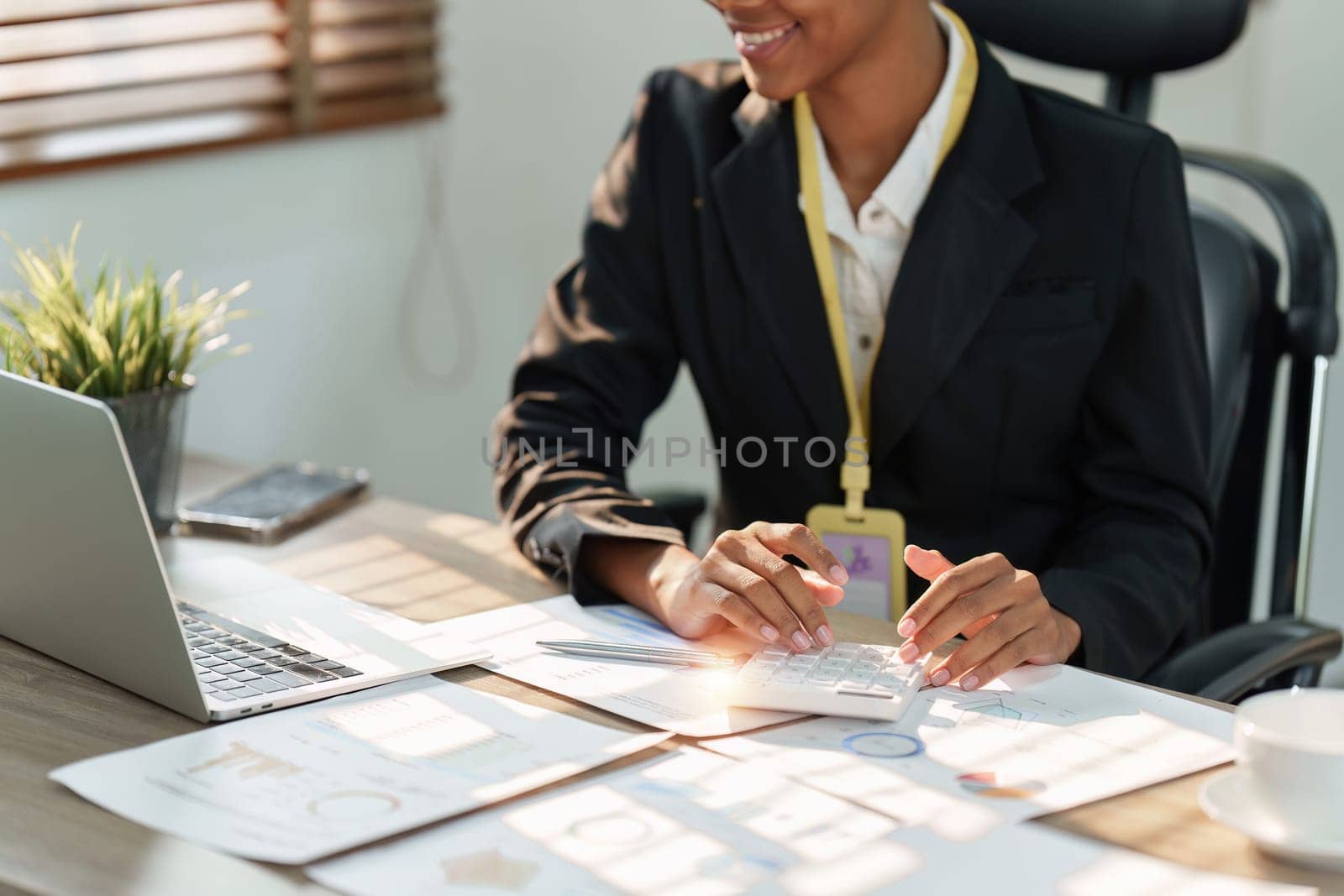 Accountant black woman working on laptop and do document, tax, exchange, accounting and Financial advisor concept by itchaznong