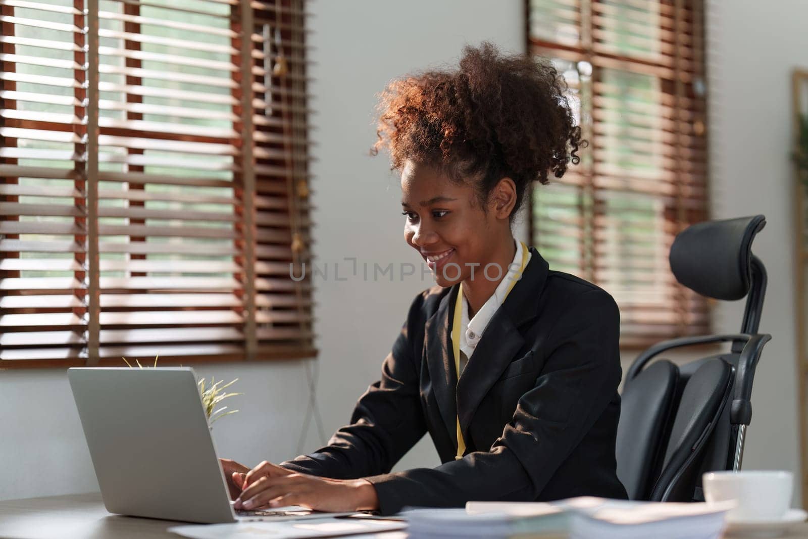 Accountant black woman working on laptop and do document, tax, exchange, accounting and Financial advisor concept.