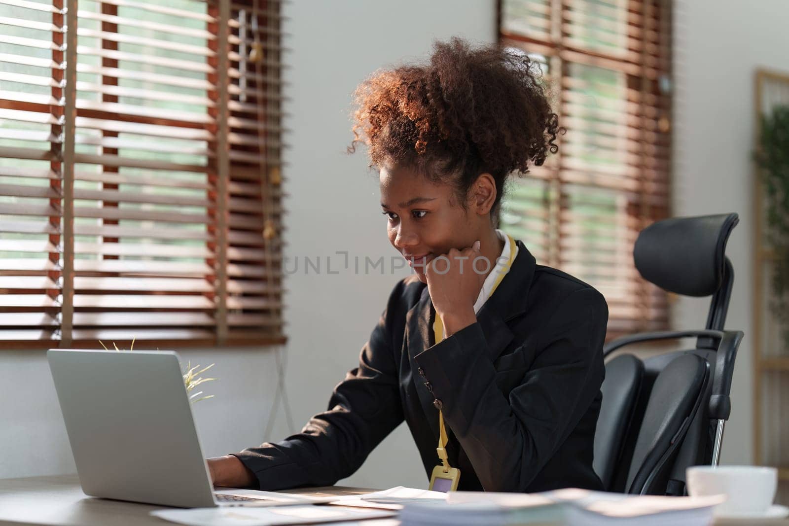 Accountant black woman working on laptop and do document, tax, exchange, accounting and Financial advisor concept by itchaznong
