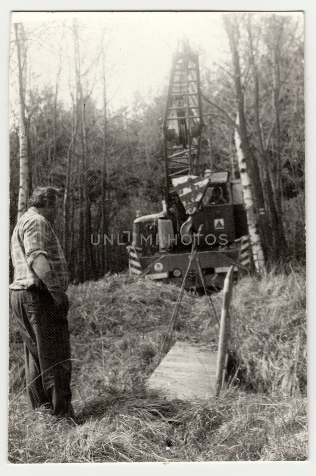 THE CZECHOSLOVAK SOCIALIST REPUBLIC - APRIL 23, 1985: Retro photo shows building of a small bridge. Vintage black and white photography.