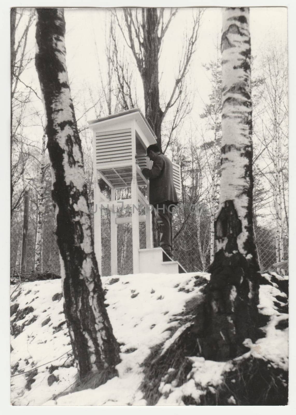 THE CZECHOSLOVAK SOCIALIST REPUBLIC - CIRCA 1950s: Retro photo shows meteorologist to control temperature. Vintage black and white photography.