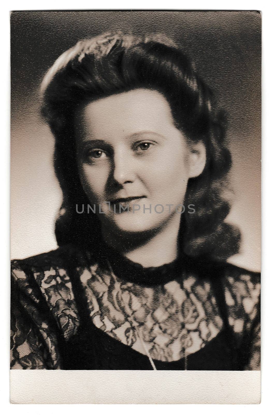 Retro photo shows portrait of young woman. Vintage black and white photography. by roman_nerud