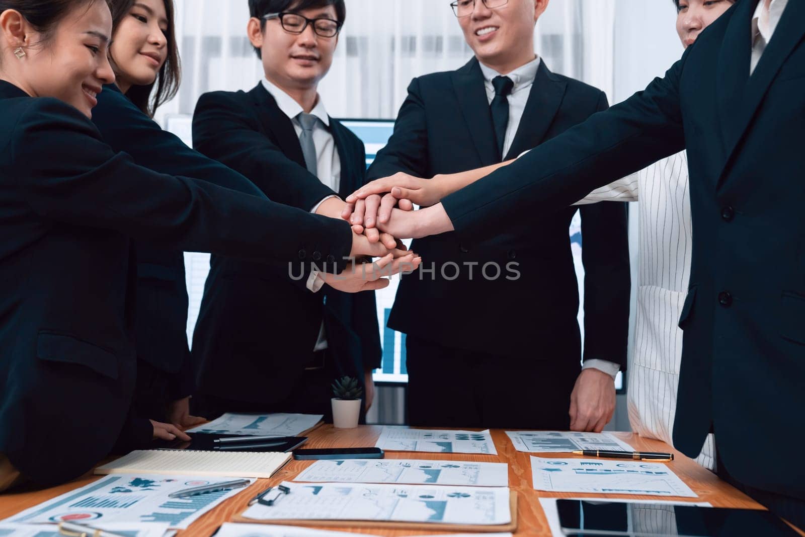 Closeup business team join hand stack together for harmony concept. by biancoblue