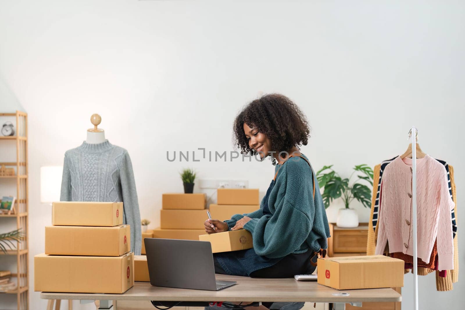 Young attractive woman owner startup business work happy with box at home prepare parcel delivery in sme supply chain, online delivery idea concept by nateemee