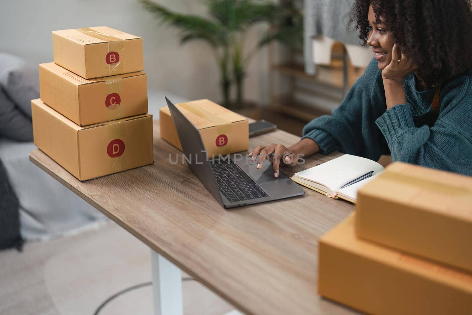 Entrepreneur, small business, SME, freelance woman working from home with lots of boxes on the side. Use smartphones and laptops for commercial monitoring. online marketing packaging box online sale by nateemee