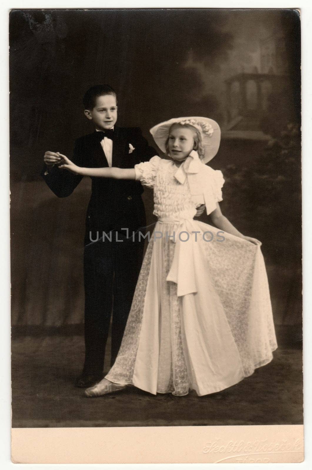 TABOR, THE CZECHOSLOVAK REPUBLIC - CIRCA 1940s: Vintage photo shows a dancing couple - children. A young couple takes dancing lessons. Retro black and white photography.