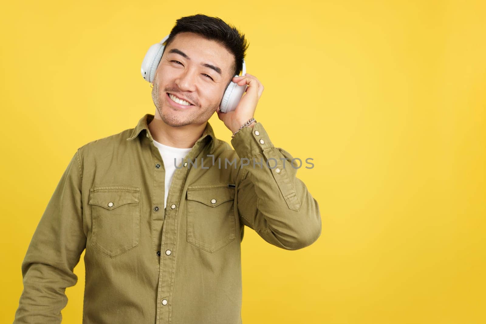 in studio with yellow background