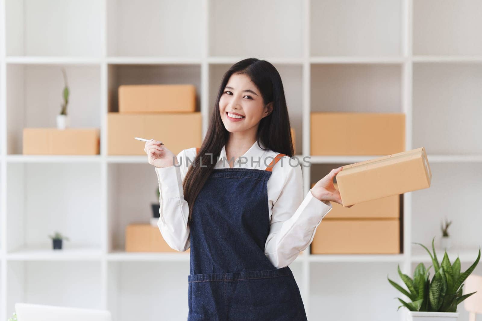 Small businesses SME owners female entrepreneurs check online orders to prepare to pack the boxes, sell to customers, sme business ideas online by itchaznong