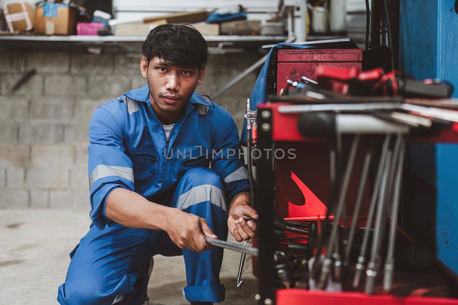Expert auto mechanic repair and service customer service work on car at garage. automobile car concept by itchaznong