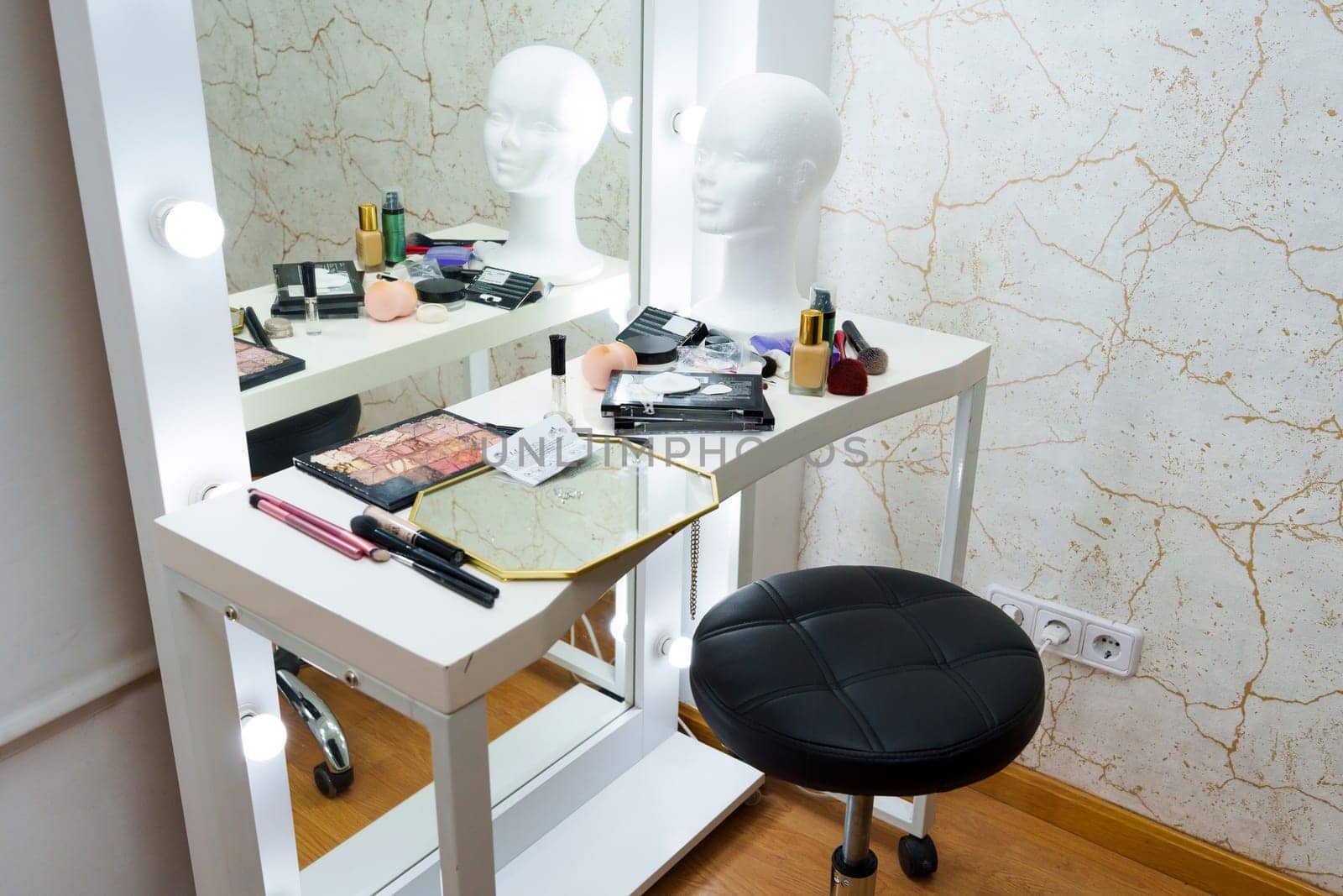 Room with a table and mirror with make up tools in a backstage