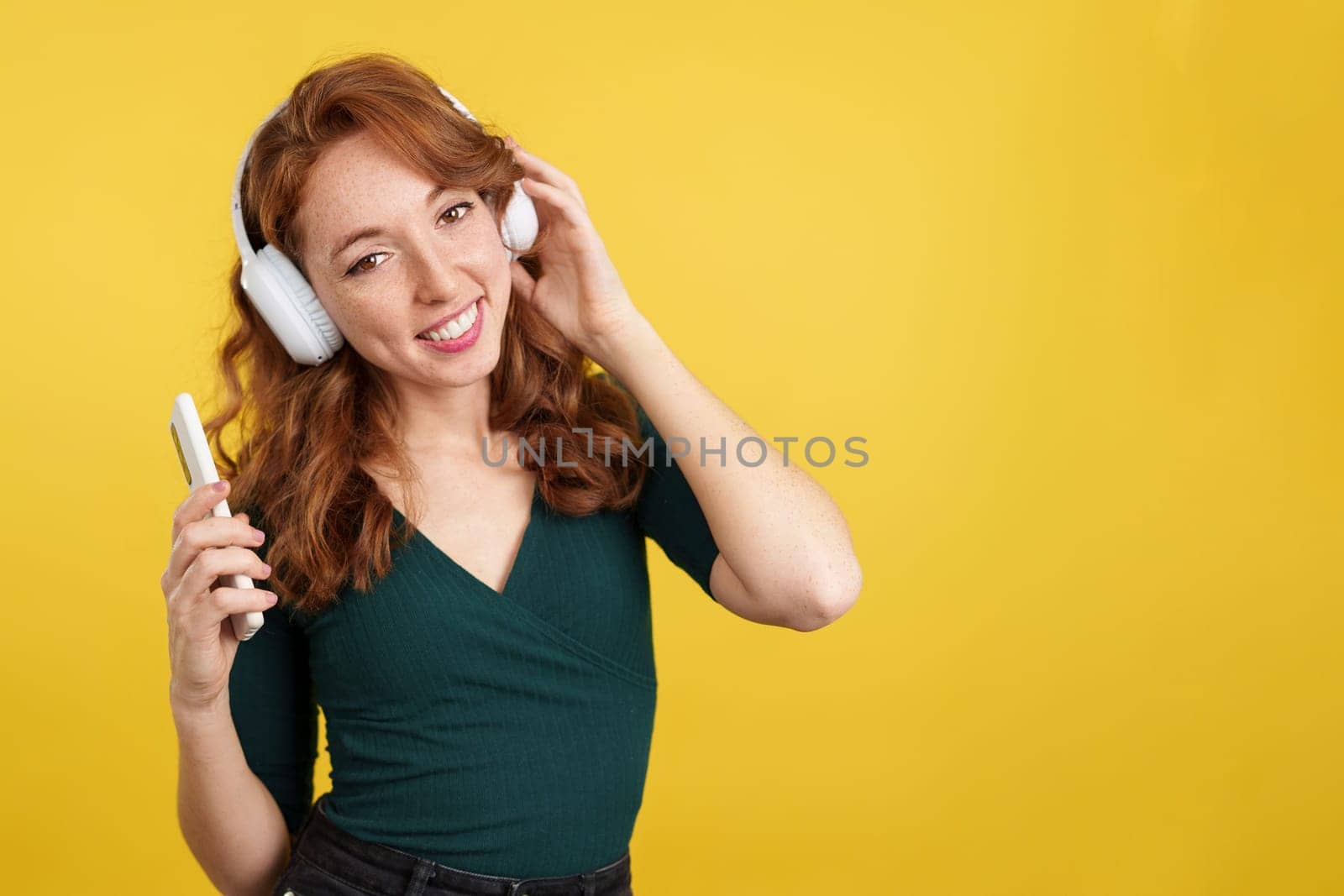 in studio with yellow background