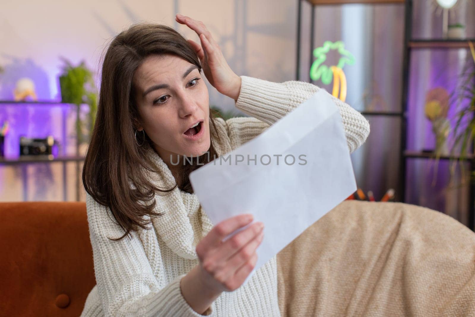 Happy woman open envelope letter, reading it. Career growth advance promotion, bank loan approve, successful admission to university monetary award long-awaited invitation great news, lottery game win