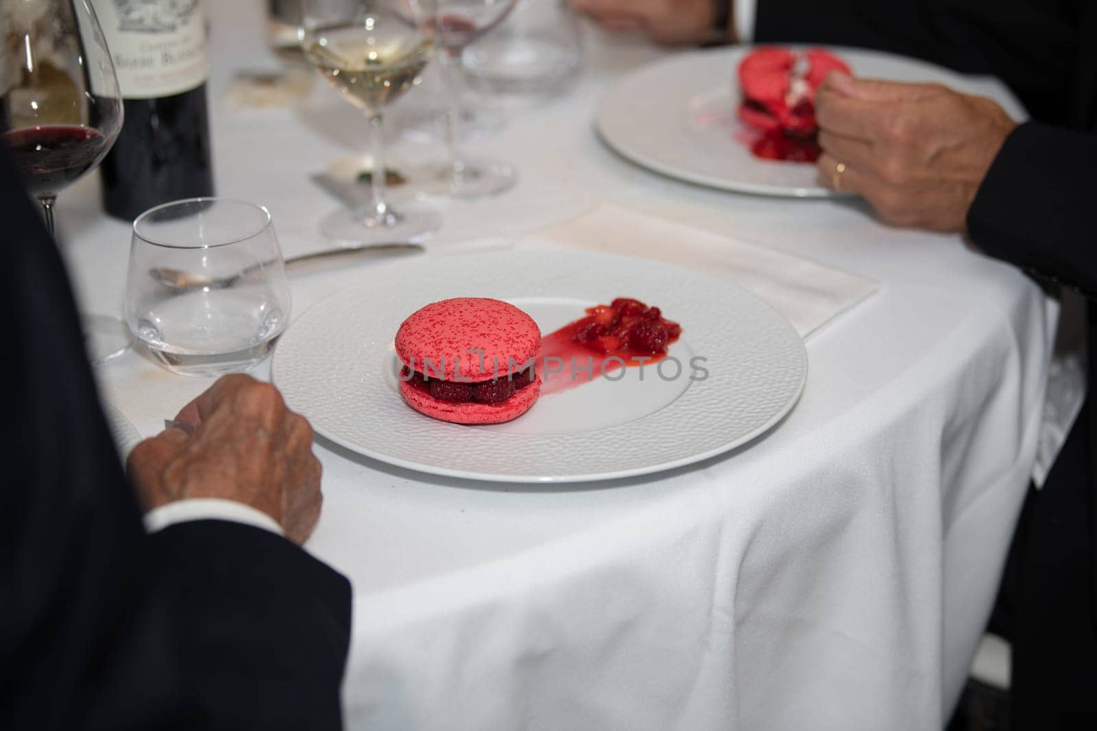 Pink macaroons on a plate at a wedding