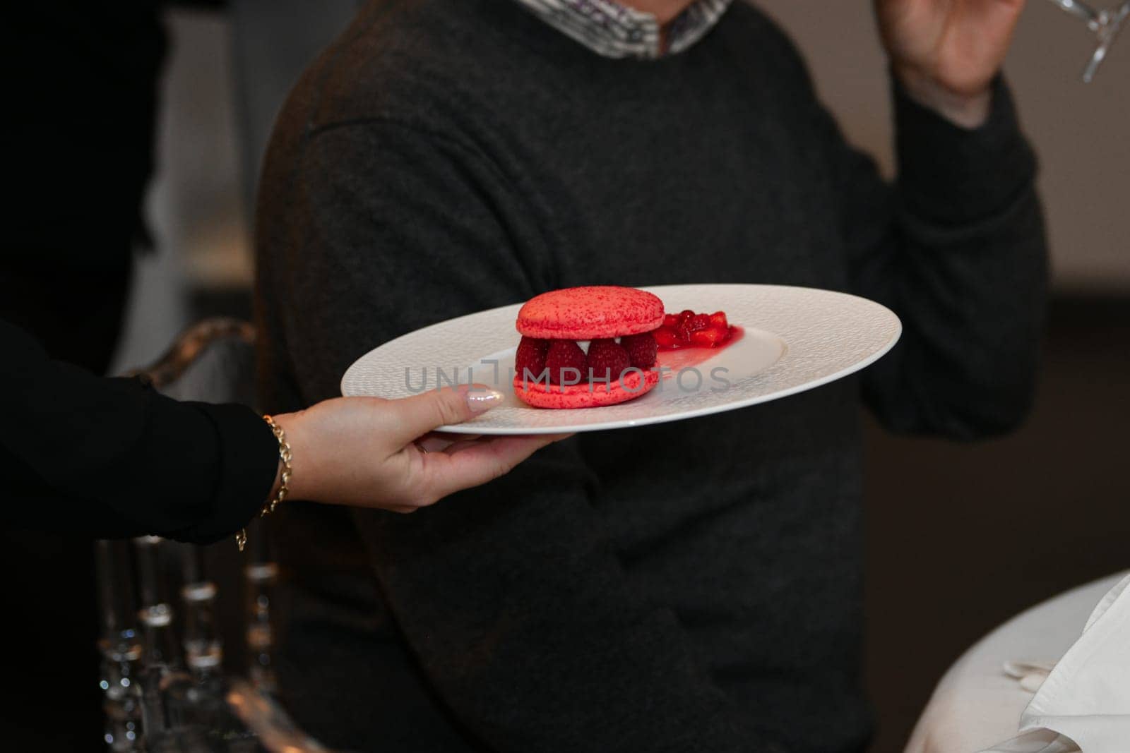 Pink macaroons on a plate at a wedding