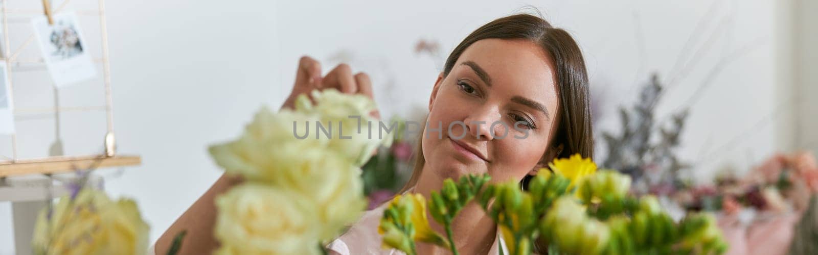 happy professional woman is working in flower shop