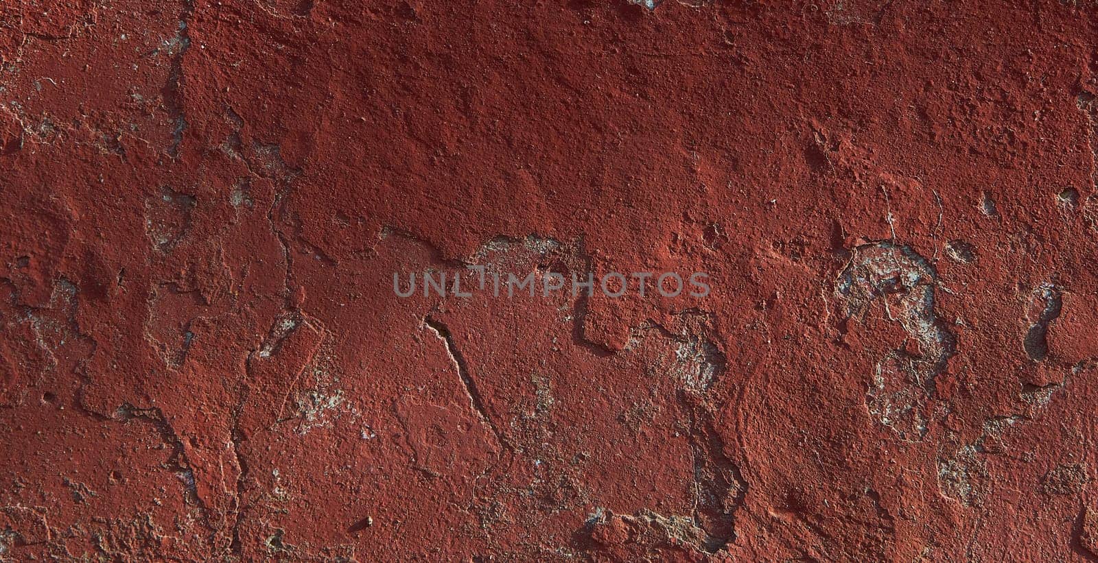 Texture of old red paint on the wall of the building by Севостьянов