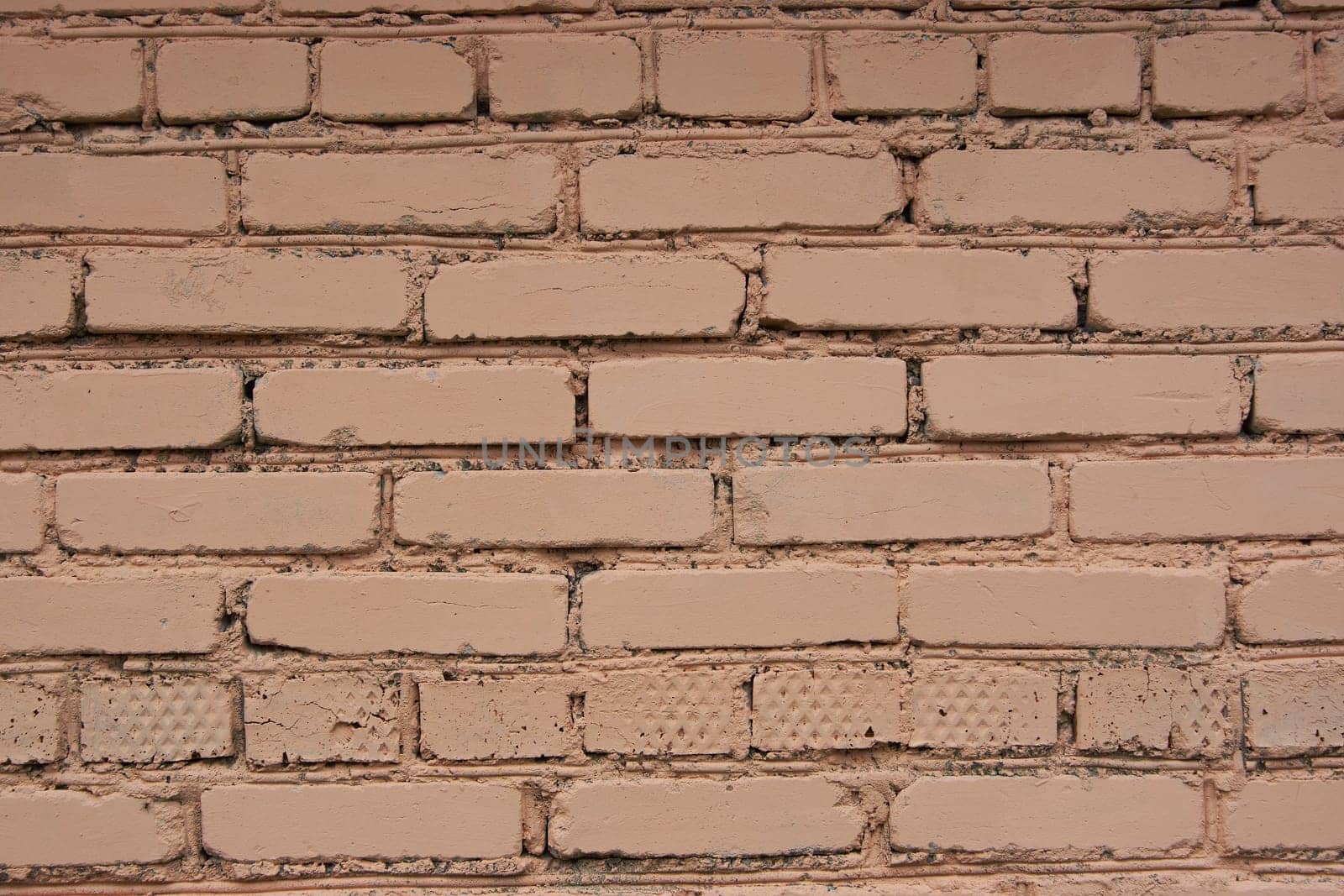 Old brown stone wall Close-up Background of stone tiles with detailed natural texture.