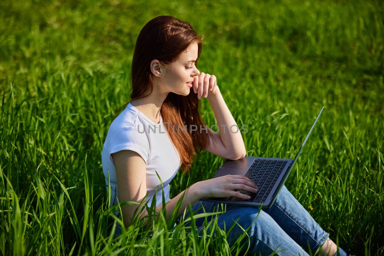 woman with laptop outdoors. High quality photo