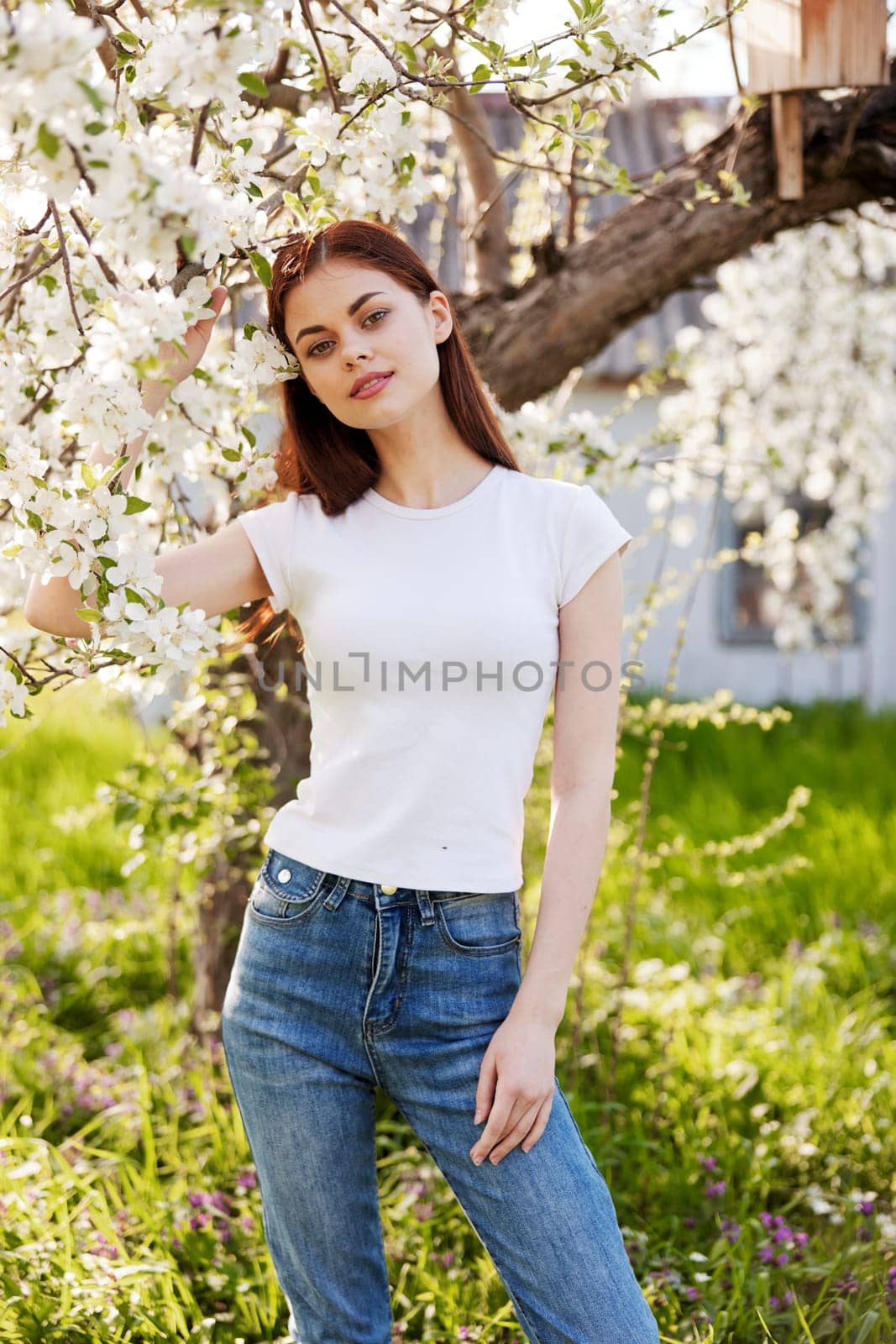 Young woman with cherry flowers portrait. by Vichizh