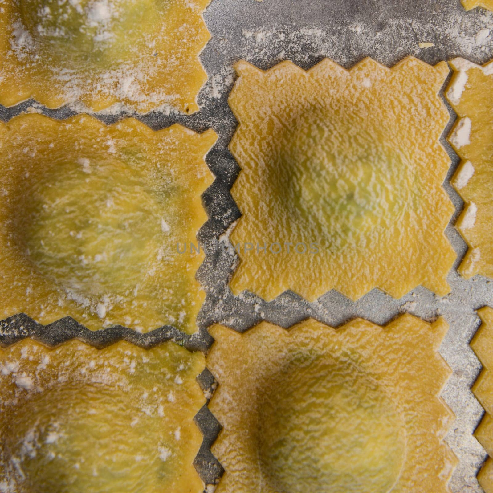 Recipe for Homemade Italian Ravioli pasta with Spinach and Ricotta Filling. High quality photo