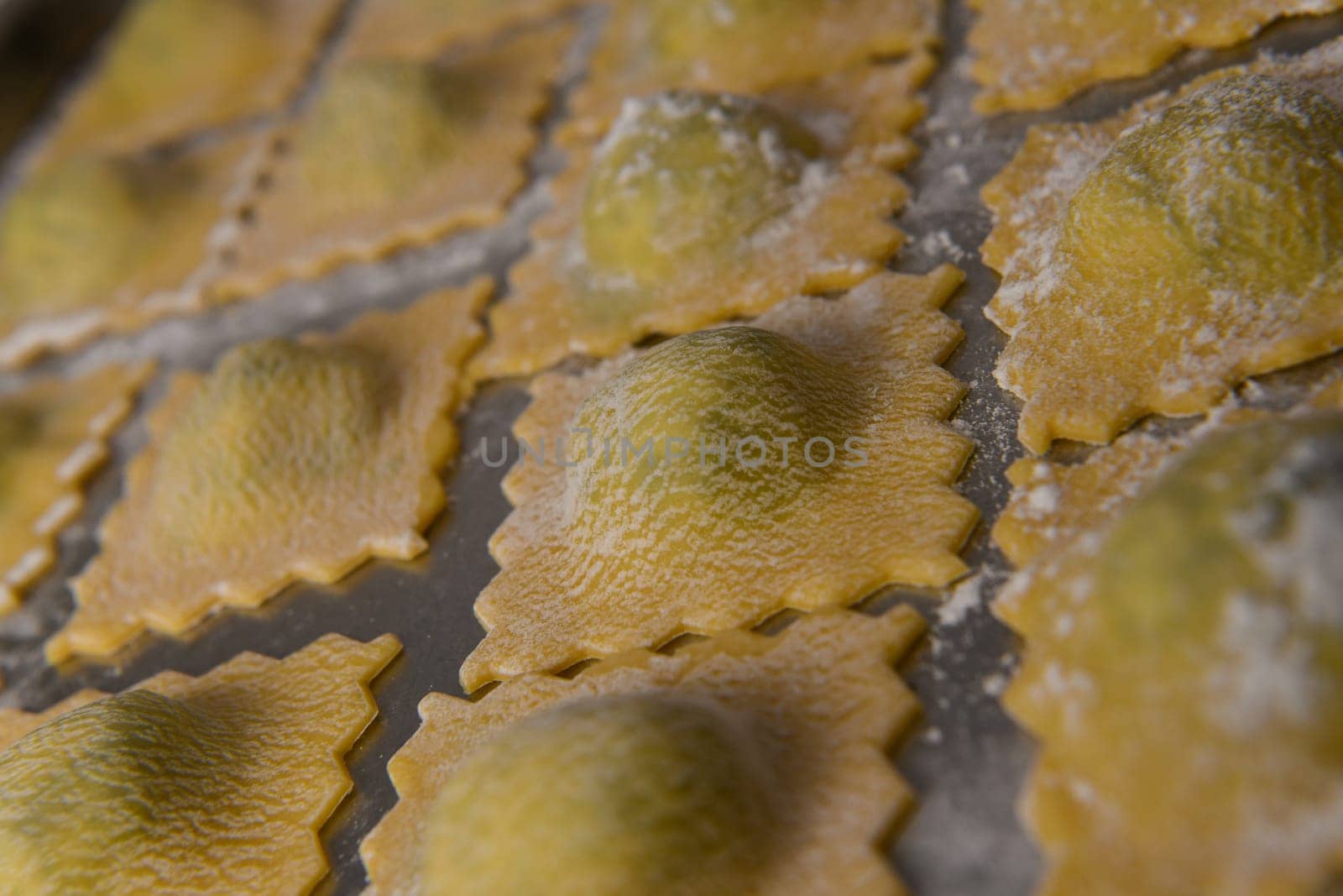 Recipe for Homemade Italian Ravioli pasta with Spinach and Ricotta Filling. High quality photo
