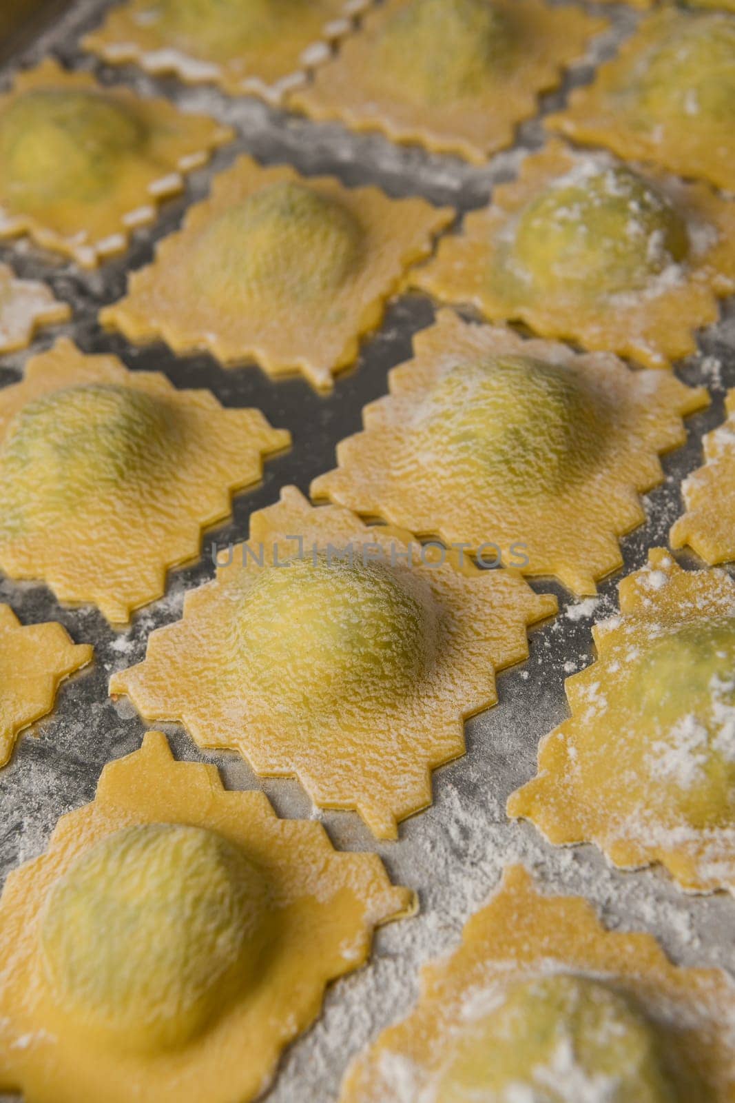 Recipe for Homemade Italian Ravioli pasta with Spinach and Ricotta Filling. High quality photo