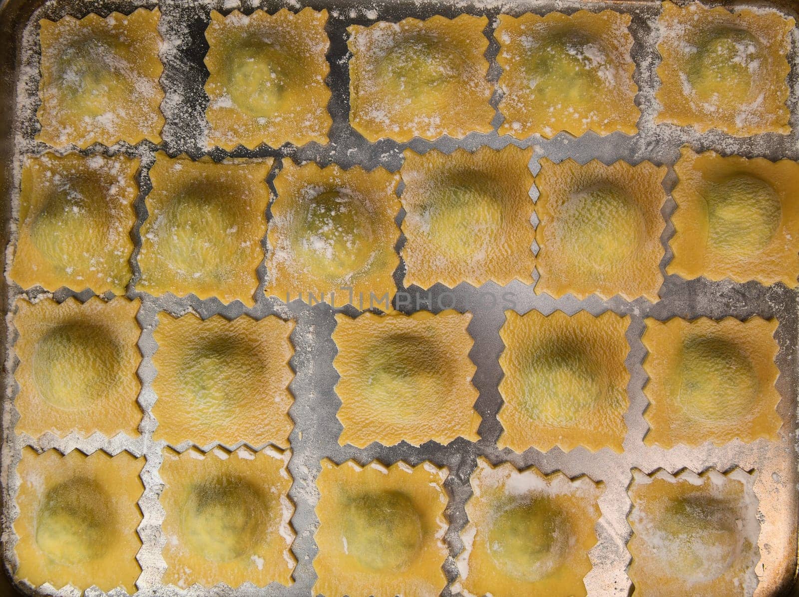 Recipe for Homemade Italian Ravioli pasta with Spinach and Ricotta Filling. High quality photo