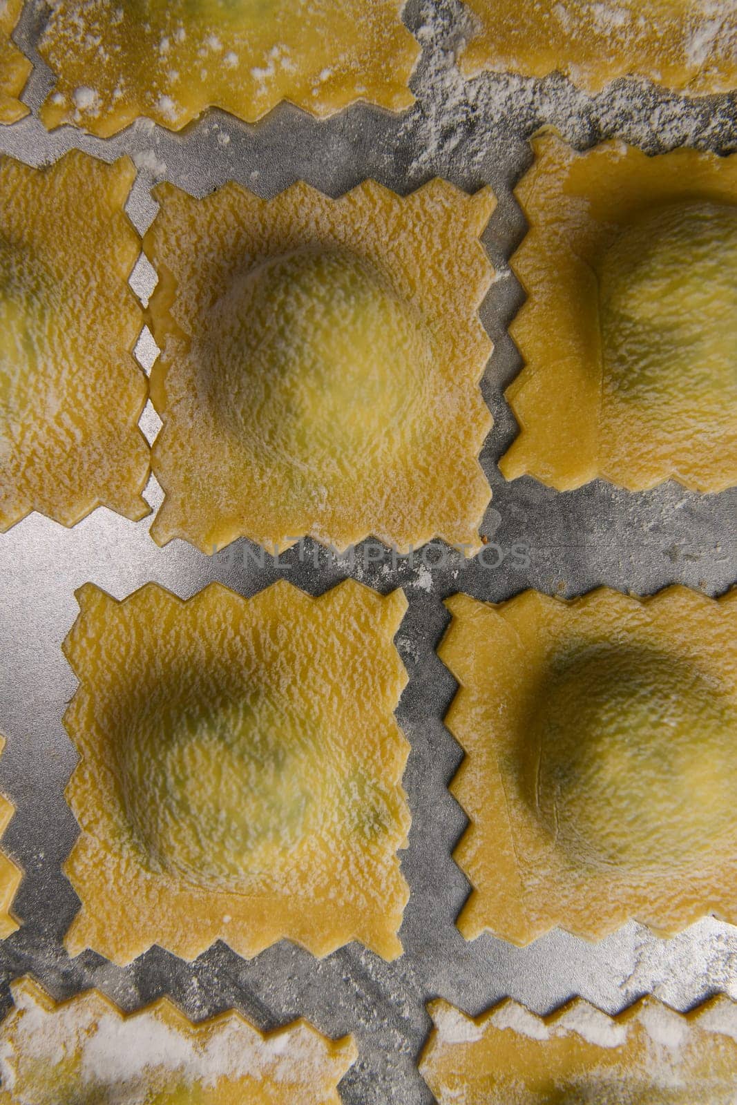 Recipe for Homemade Italian Ravioli pasta with Spinach and Ricotta Filling. High quality photo