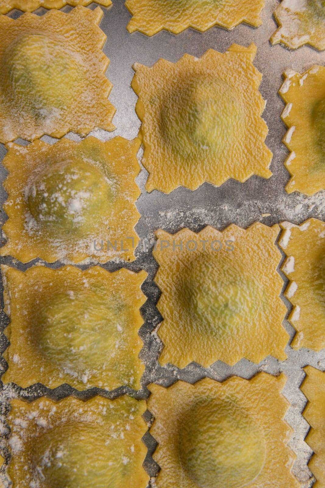 Recipe for Homemade Italian Ravioli pasta with Spinach and Ricotta Filling. High quality photo