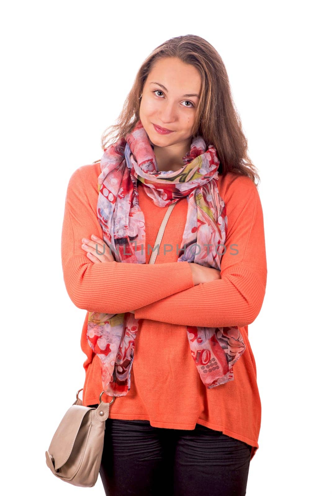 portrait of a pretty young girl in an orange sweater on a white background
