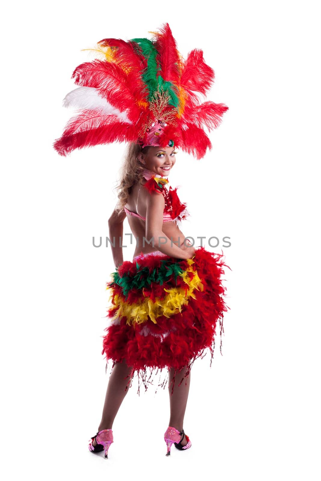 Cheerful girl posing in colorful carnival costume isolated on white