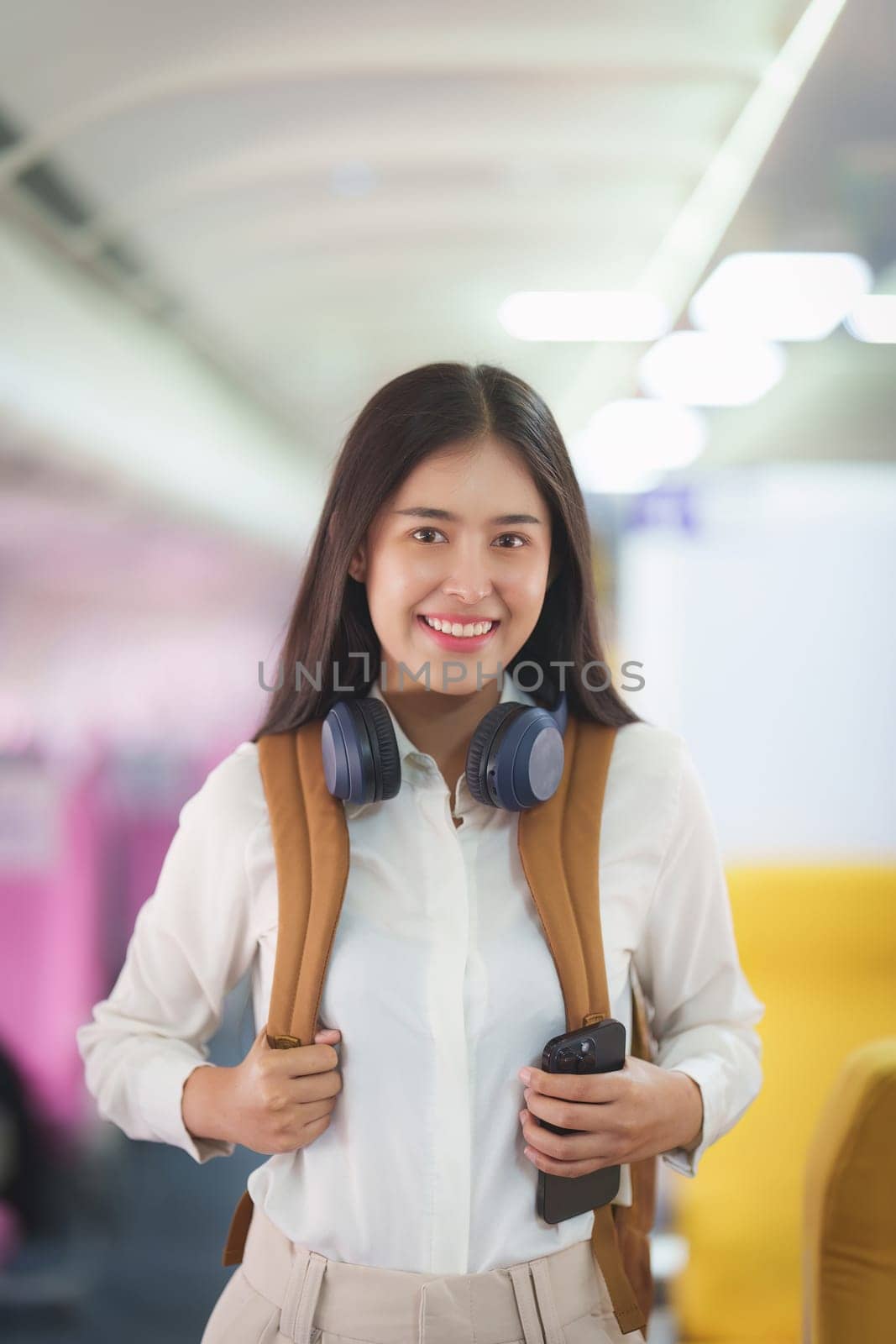 Beautiful Asian traveler woman with backpack when flight is landing. Travel, Airplane concept.