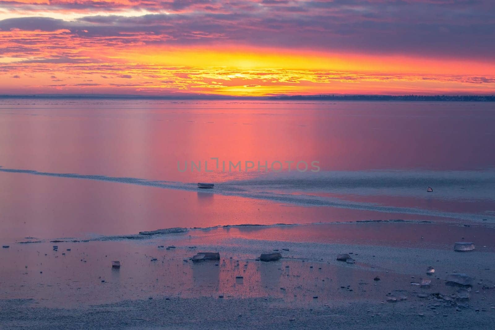 Winter sunset over the lake Balaton of Hungary by Digoarpi