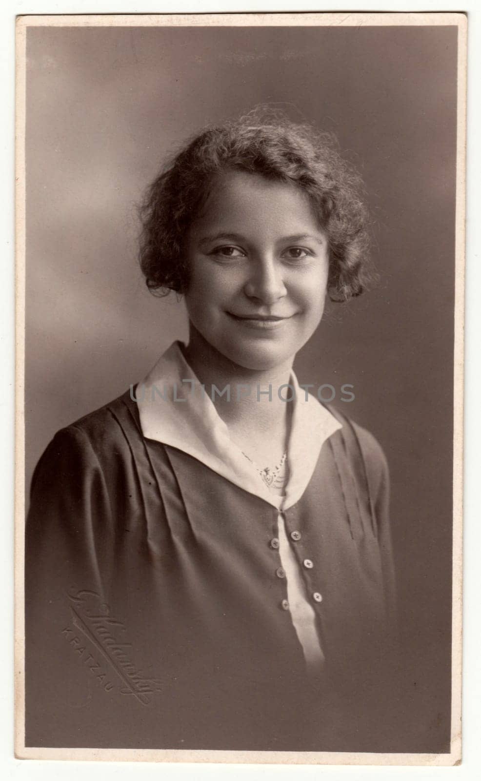 Vintage photo shows woman - portrait. Retro black and white studio photography with sepia effect. by roman_nerud